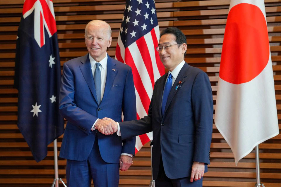 Prime Minister of Japan Fumio Kishida welcomes U.S. President Joe Biden at the entrance hall of the Prime Minister’s Office of Japan in Tokyo, Japan, May 24, 2022. Zhang Xiaoyu/Pool via REUTERS